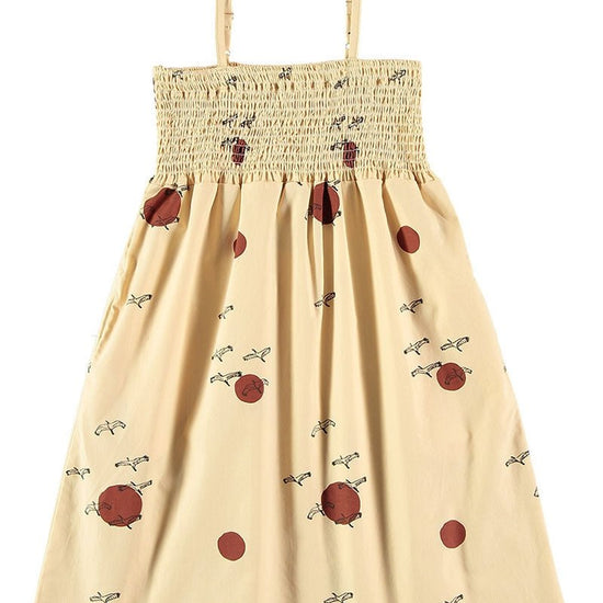 Smocked dress in beige - TIRALAHILACHA