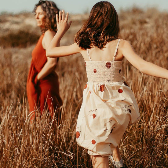 Smocked dress in beige - TIRALAHILACHA