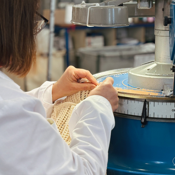 Person working with a machine in a factory setting