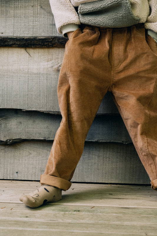 Pantalones pana oversized algodón orgánico teja